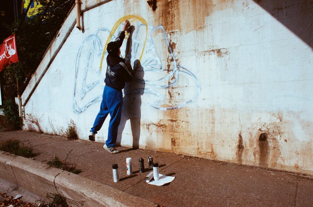 Graffiti artists paint a viaduct - Ellen Domke for Chicago Sun-Times