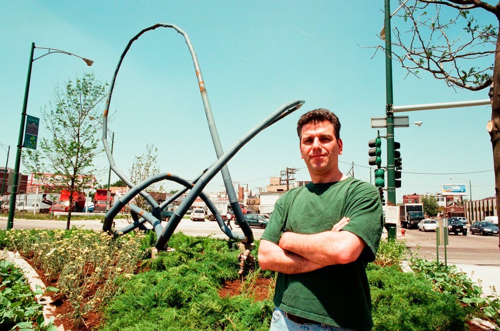 Sculptor Josh Garber with his sculpture, 