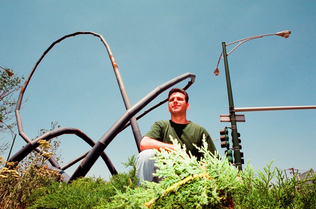 Sculptor Josh Garber with his sculpture, 