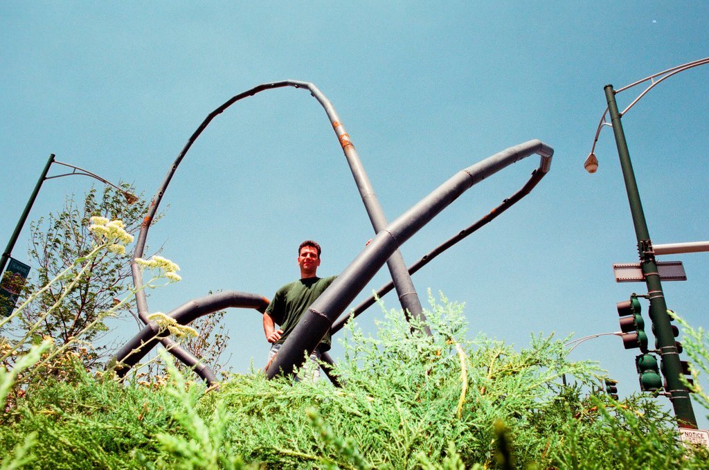 Sculptor Josh Garber with his sculpture, 