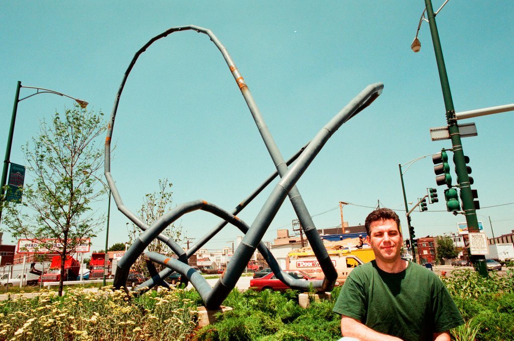 Sculptor Josh Garber with his sculpture, 