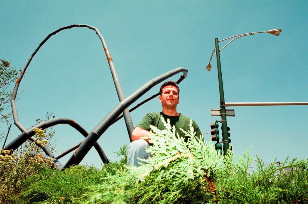 Sculptor Josh Garber with his sculpture, 