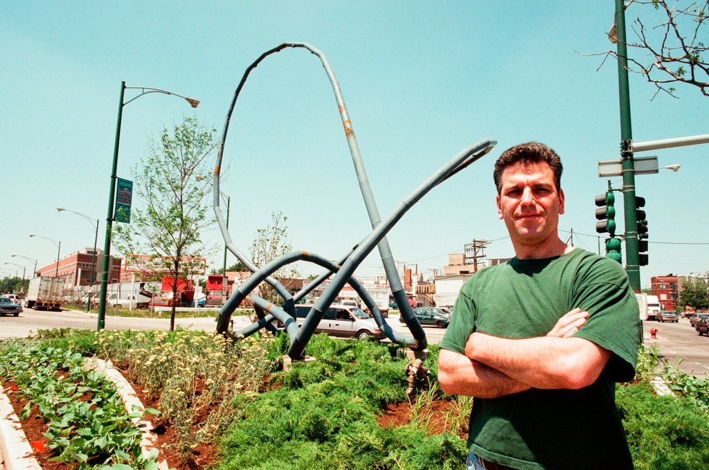 Sculptor Josh Garber with his sculpture, 