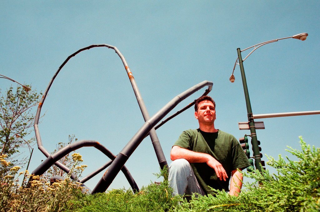 Sculptor Josh Garber with his sculpture, 
