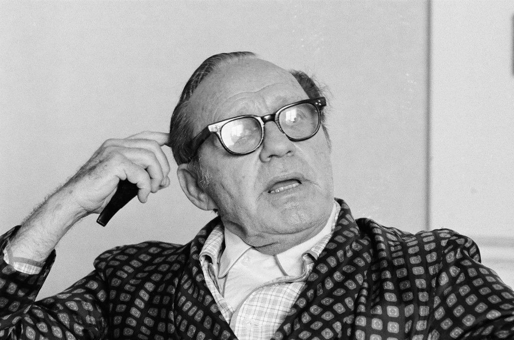 Jack Benny sitting in a chair - Charles Krejcsi for Chicago Sun-Times