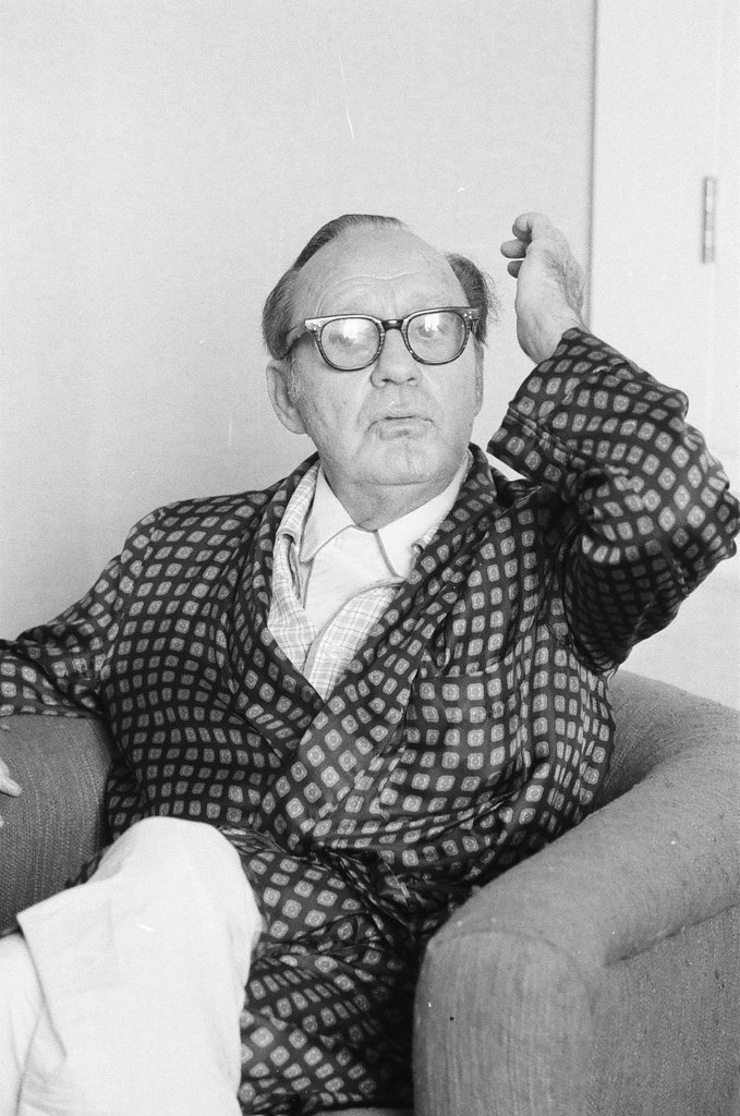 Jack Benny sitting in a chair - Charles Krejcsi for Chicago Sun-Times