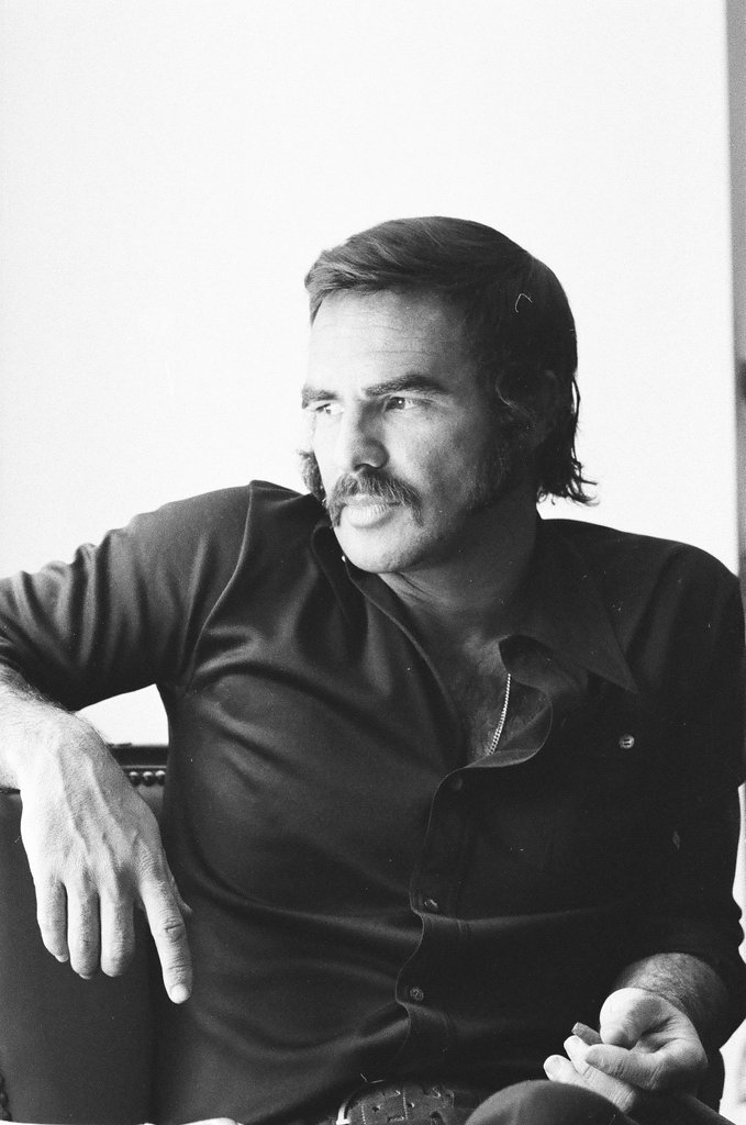 Burt Reynolds sits on a couch - Carmen Reporto for Chicago Sun-Times