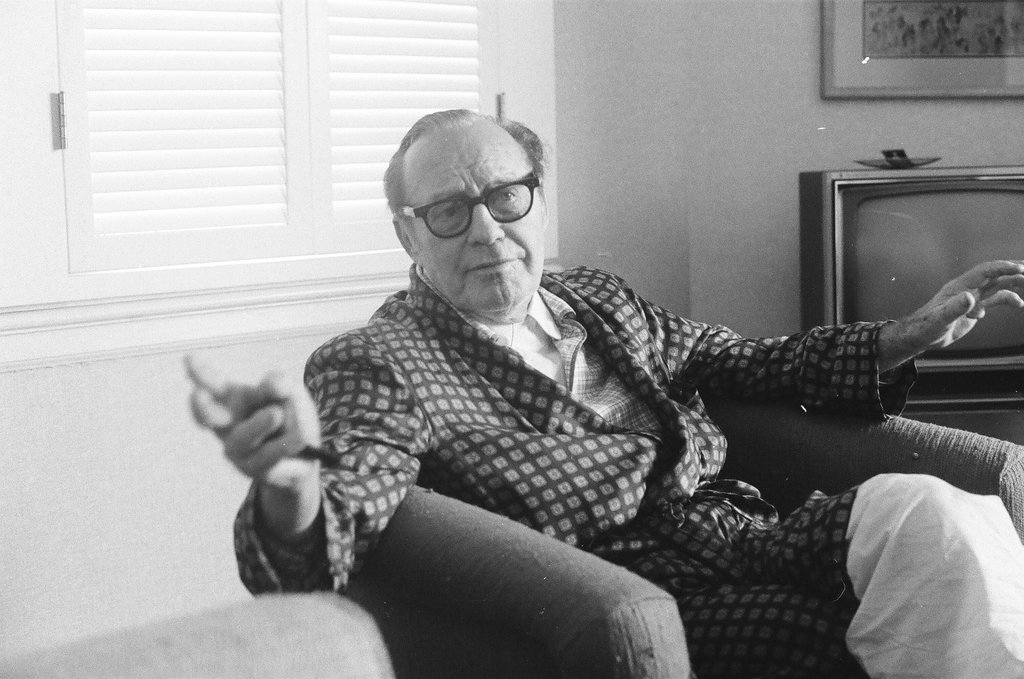 Jack Benny sitting in a chair - Charles Krejcsi for Chicago Sun-Times