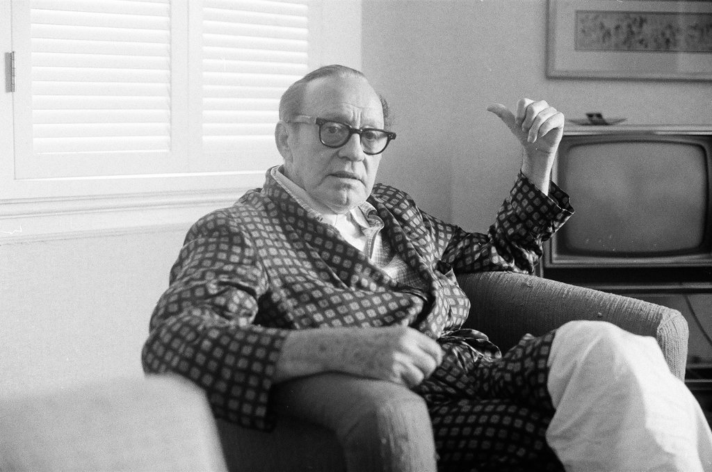 Jack Benny sitting in a chair - Charles Krejcsi for Chicago Sun-Times