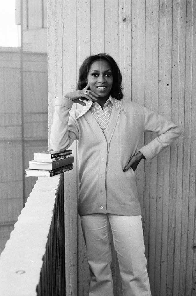 Lola Falana posing with stack of books - Fred Stein for Chicago Daily News