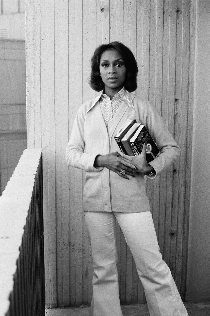 Lola Falana posing with stack of books - Fred Stein for Chicago Daily News