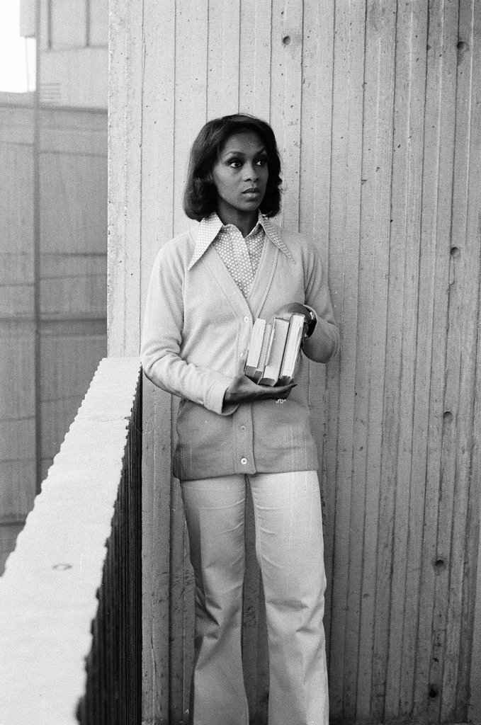 Lola Falana posing with stack of books - Fred Stein for Chicago Daily News