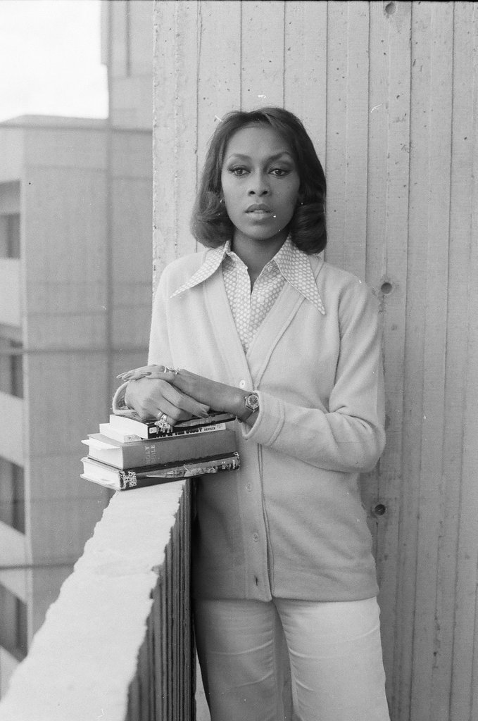 Lola Falana posing with stack of books - Fred Stein for Chicago Daily News