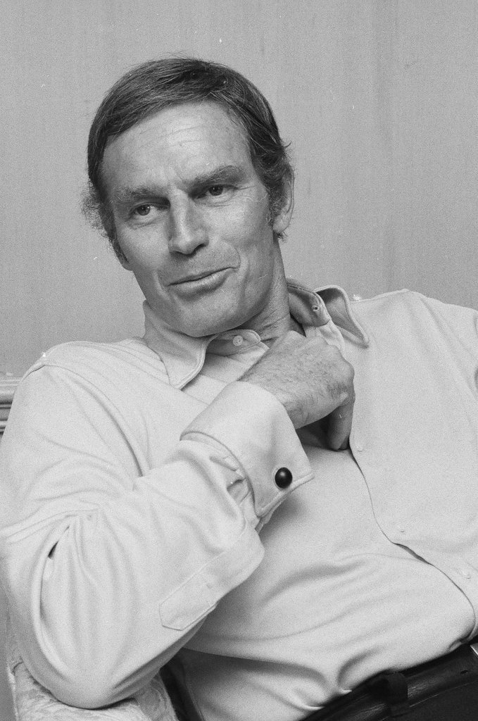 Charleton Heston sitting in a chair - Chuck (Charles) Kirman for Chicago Sun-Times