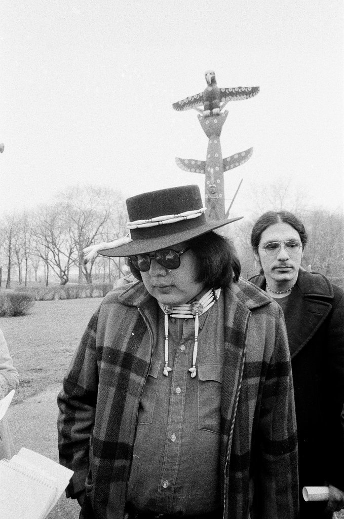 Native American holds addresses the press at totem pole - Chicago Sun-Times