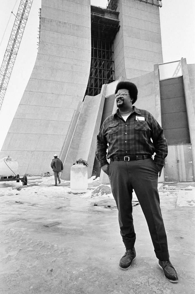Man standing in front of laboratory under construction - Chicago Sun-Times