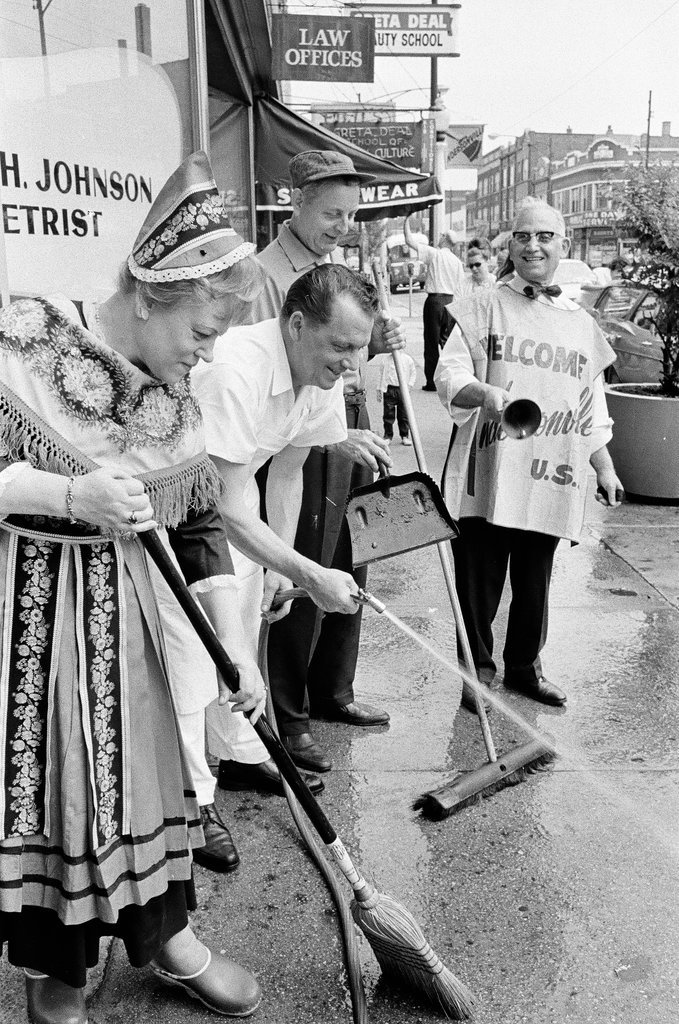 People in Scandinavian costume cleaning sidewalk - Don Burk for Chicago Sun-Times