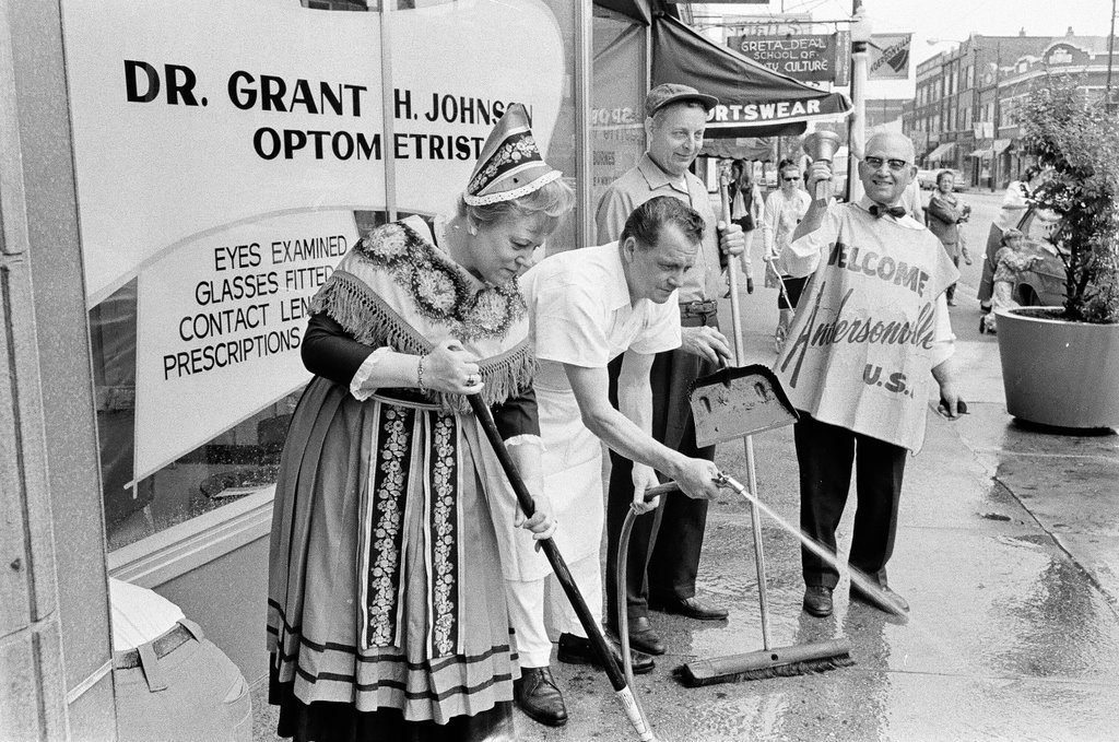 People in Scandinavian costume cleaning sidewalk - Don Burk for Chicago Sun-Times