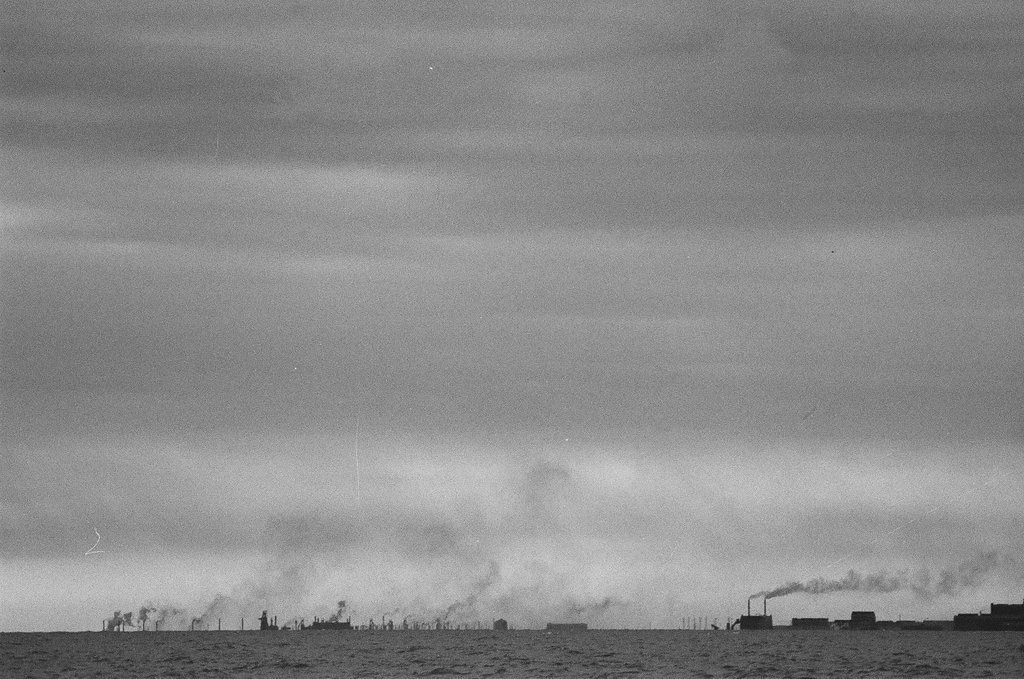 Factory smokestacks across Lake Michigan - Fred Stein for Chicago Daily News