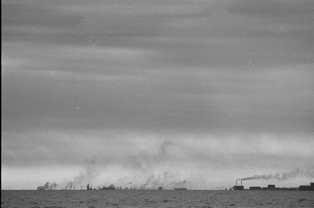 Factory smokestacks across Lake Michigan - Fred Stein for Chicago Daily News