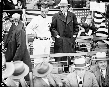Baseball manager Ray Schalk, of the American League's Chicago White Sox, and Charles Dawes, U.S. Vice-President from 1925-1929, standing in the grandstands at Comiskey Park - Chicago Daily News, Inc.