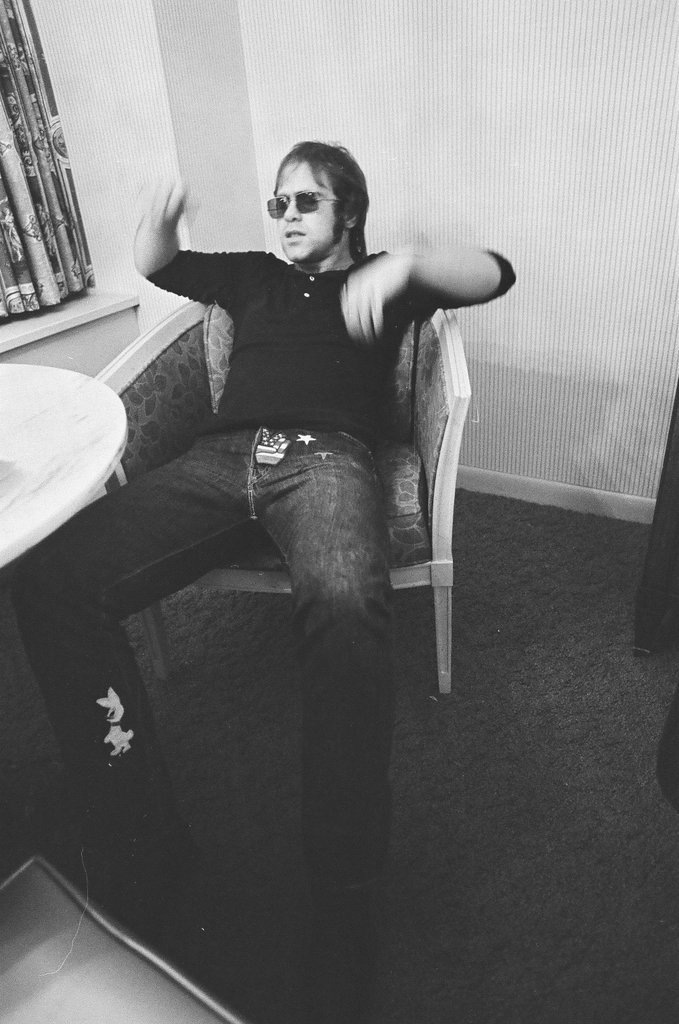 Elton John sits in a chair - Bob (Robert) Black for Chicago Sun-Times