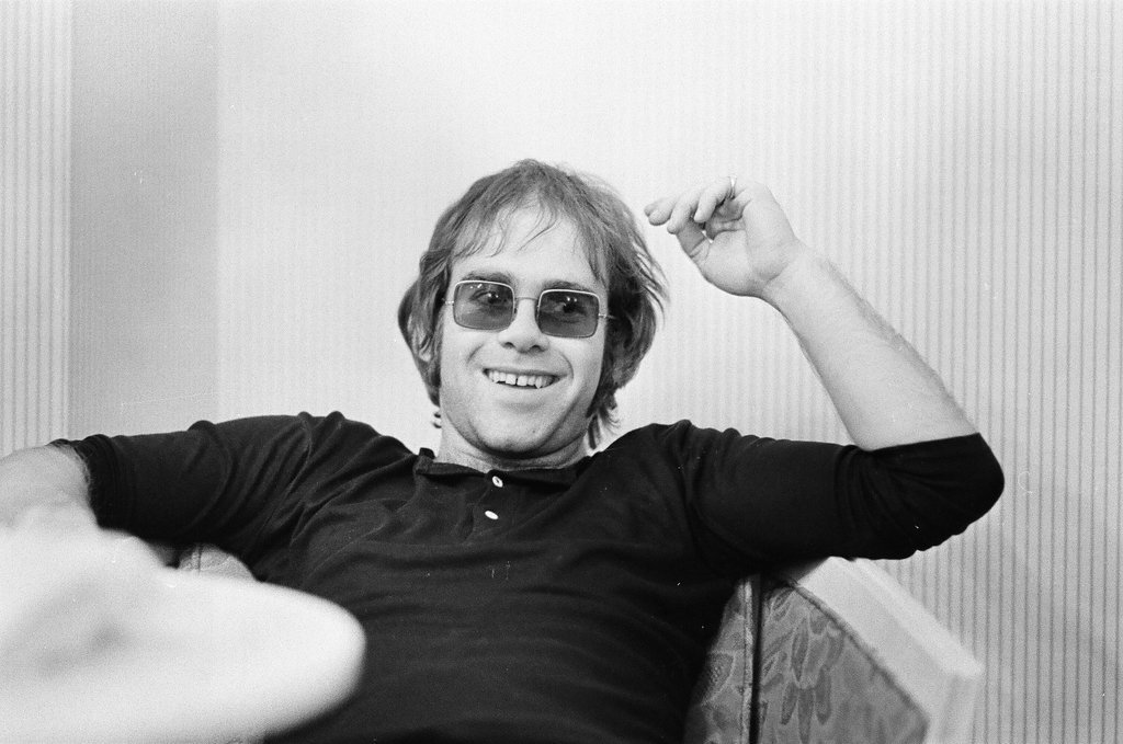 Elton John sits in a chair - Bob (Robert) Black for Chicago Sun-Times