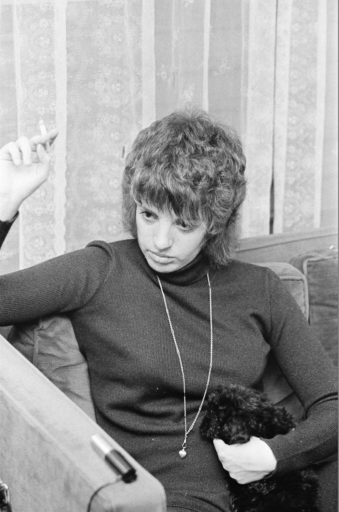 Liza Minnelli sitting on a couch - Chicago Sun-Times