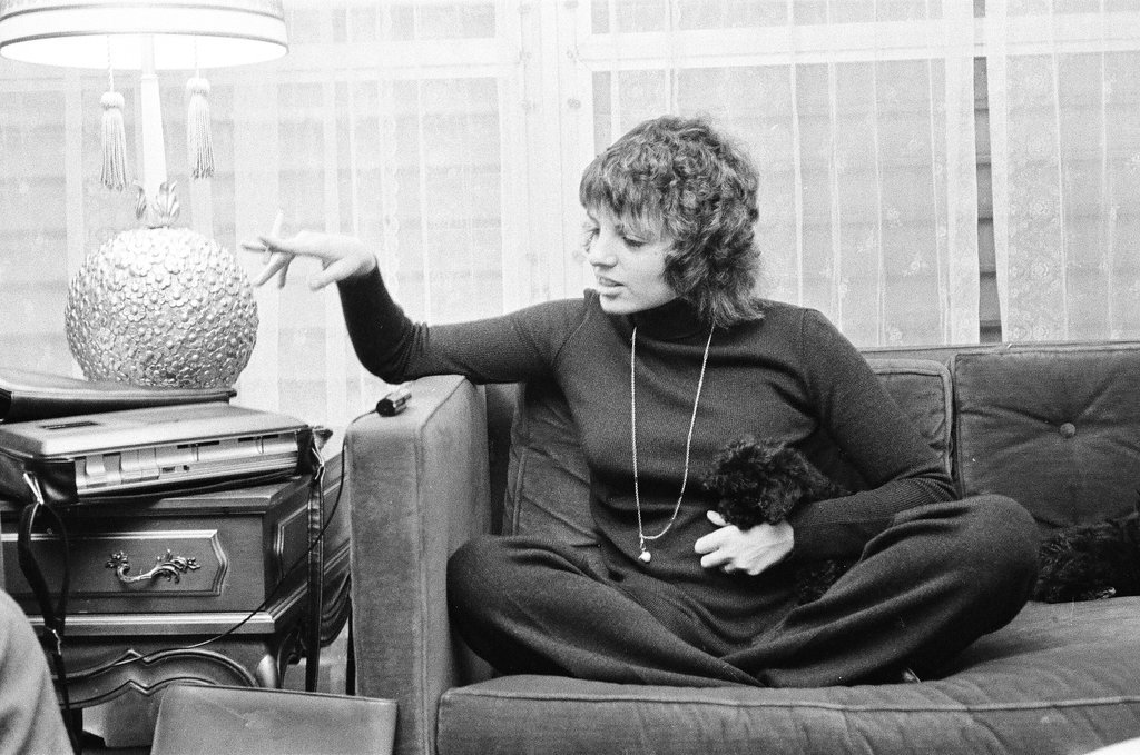 Liza Minnelli sitting on a couch - Chicago Sun-Times