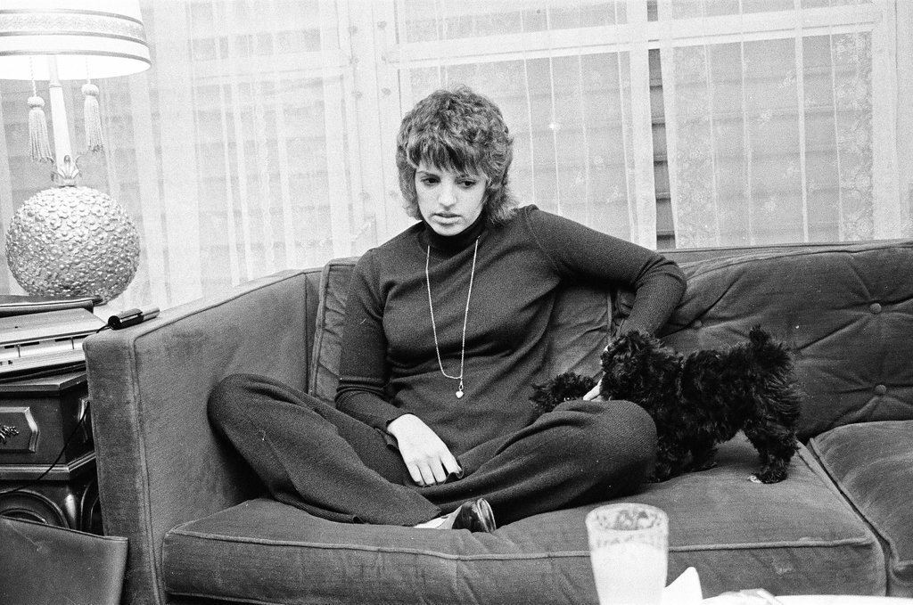 Liza Minnelli sitting on a couch - Chicago Sun-Times