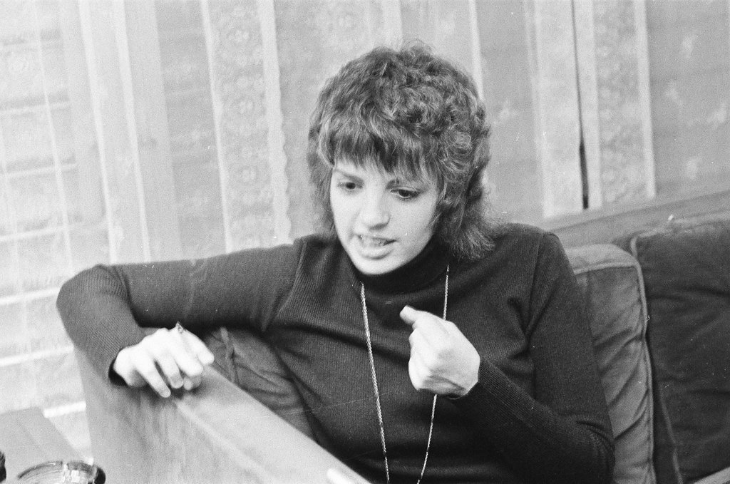 Liza Minnelli sitting on a couch - Chicago Sun-Times