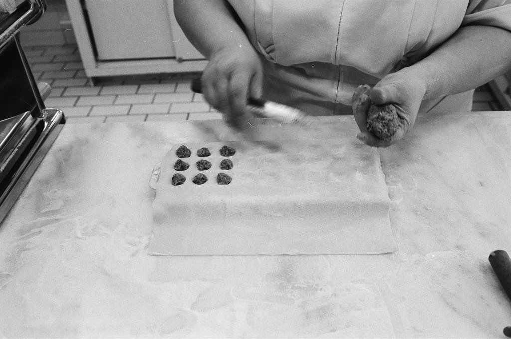 A woman making ravioli at the Pump Room - Chicago Sun-Times