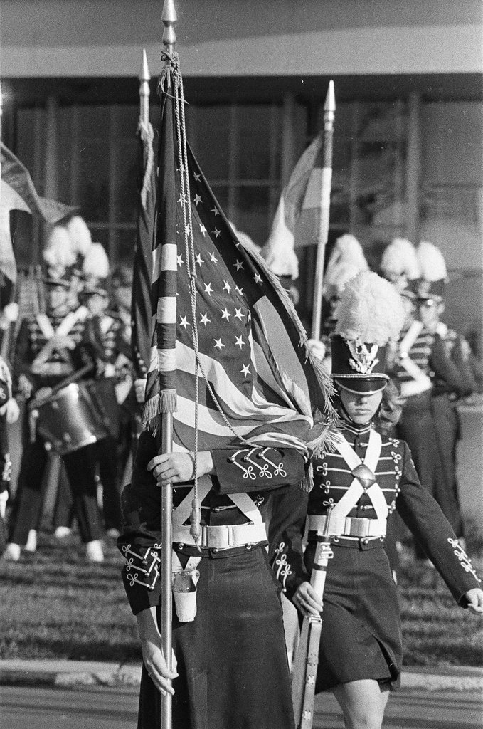 High school student holds American flag - Chicago Sun-Times
