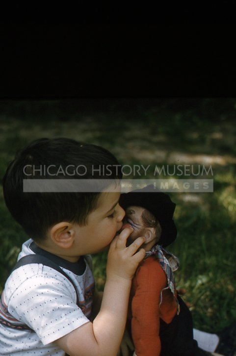 A boy kissing a doll - Maier, Vivian