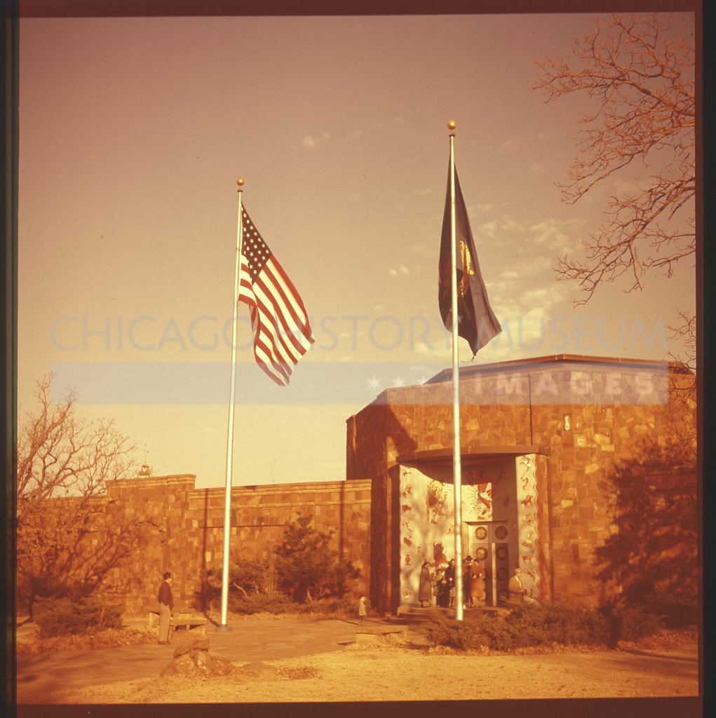 Flag poles in front of a building - Maier, Vivian