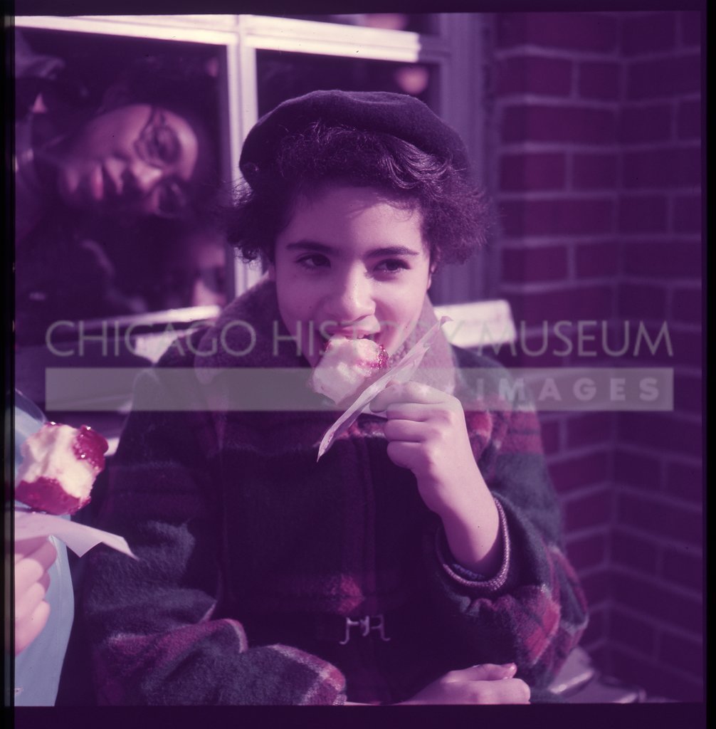 Girl eating a candy apple in Central Park - Maier, Vivian