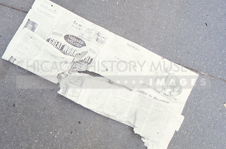 Newspaper on sidewalk - Maier, Vivian