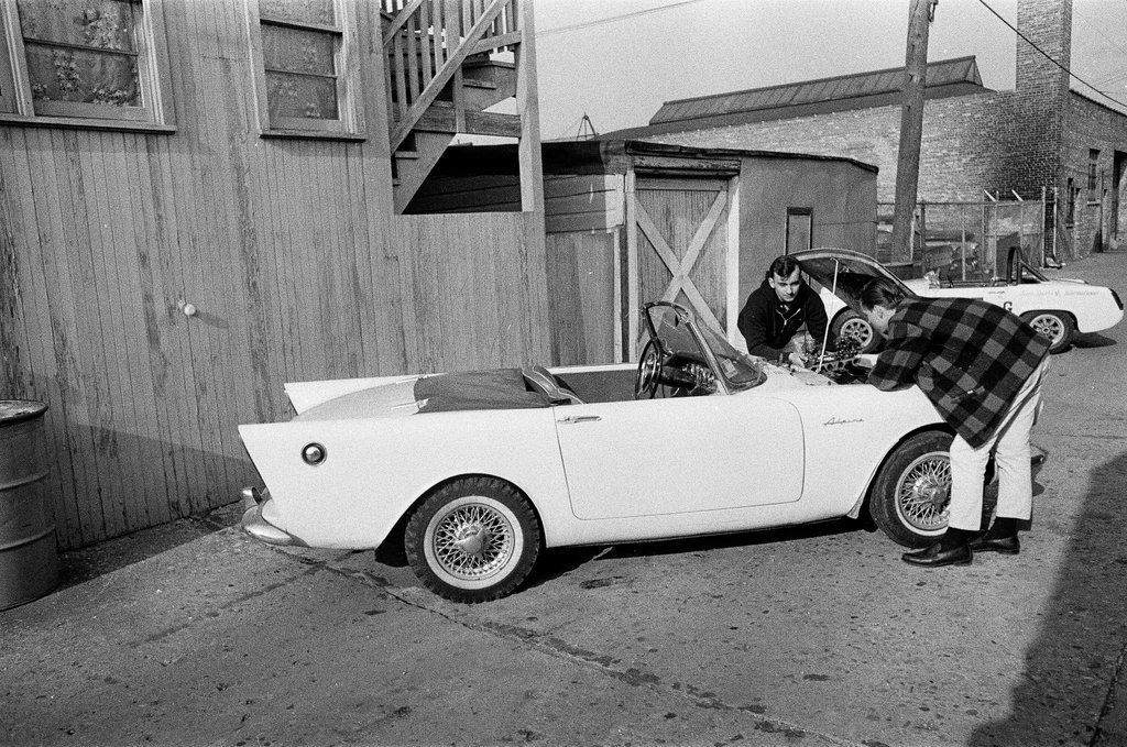 George Westlund sands a car - John Tweedle for Chicago Sun-Times