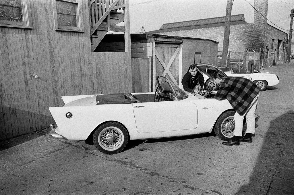 George Westlund sands a car - John Tweedle for Chicago Sun-Times