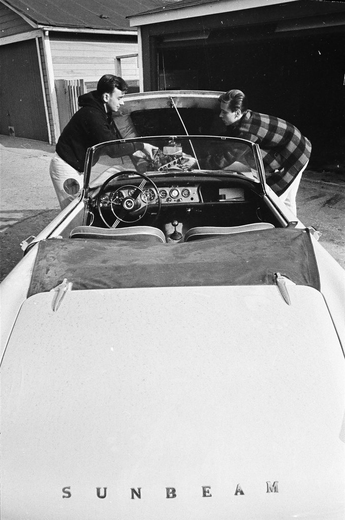 George Westlund sands a car - John Tweedle for Chicago Sun-Times