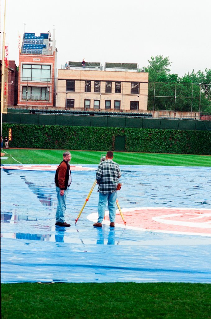 Surveyors measure Glenallen Hill's home runs at Wrigley Field - John H. White for Chicago Sun-Times