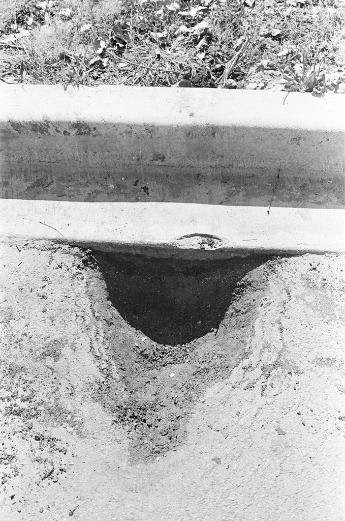 Broken curb cement - John Jaqua for Chicago Sun-Times