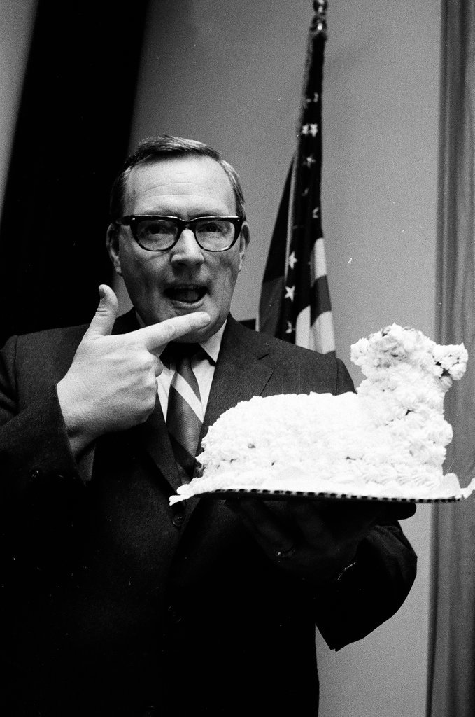 Governor Ogilvie tastes cake frosting - Larry Graff for Chicago Sun-Times