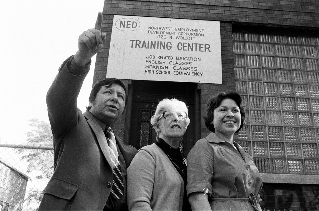 Training Center employees in front of building - Carmen Reporto for Chicago Sun-Times