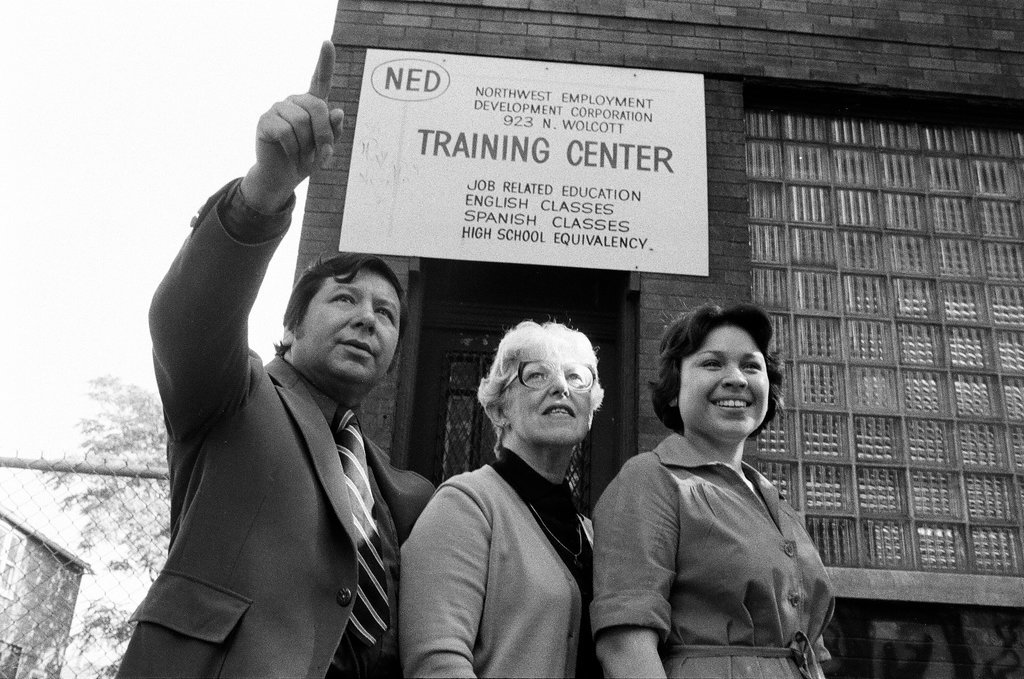 Training Center employees in front of building - Carmen Reporto for Chicago Sun-Times