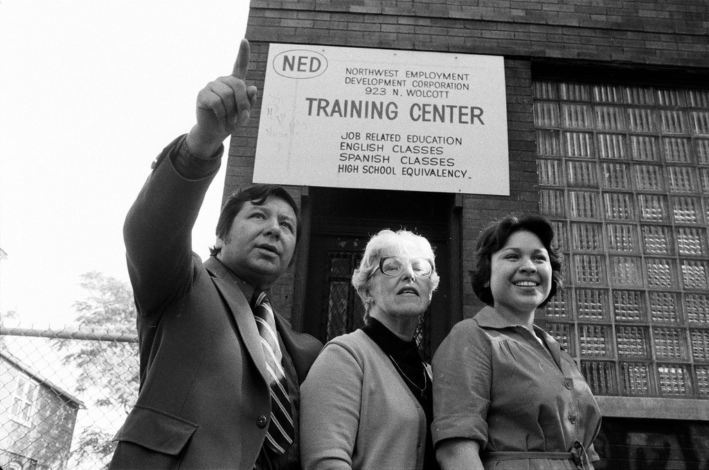 Training Center employees in front of building - Carmen Reporto for Chicago Sun-Times
