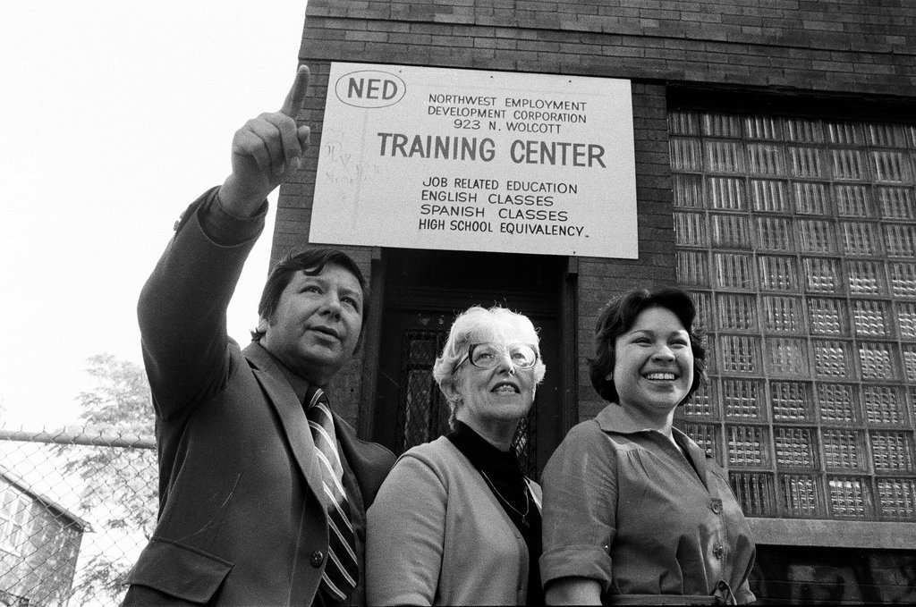 Training Center employees in front of building - Carmen Reporto for Chicago Sun-Times