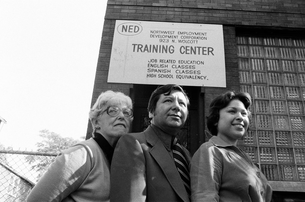 Training Center employees in front of building - Carmen Reporto for Chicago Sun-Times