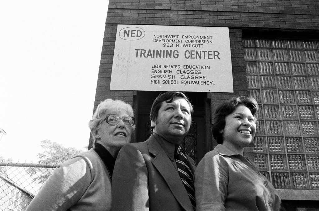 Training Center employees in front of building - Carmen Reporto for Chicago Sun-Times
