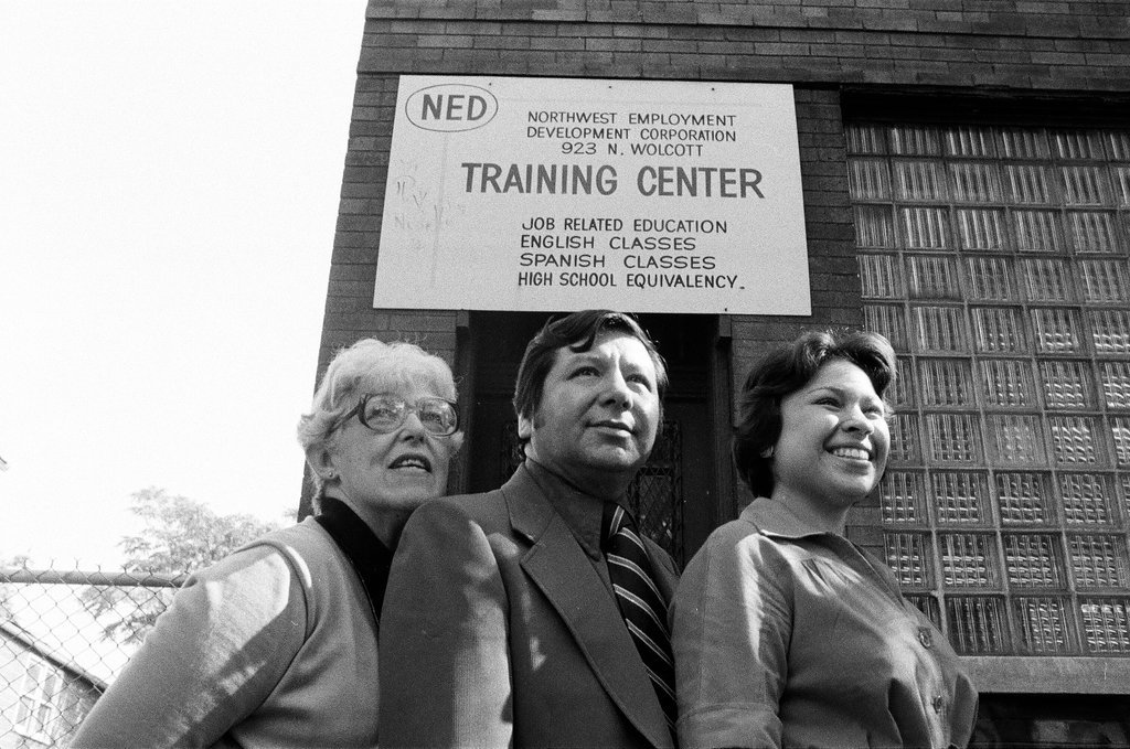 Training Center employees in front of building - Carmen Reporto for Chicago Sun-Times